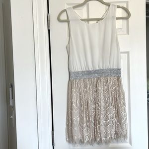 White sleeveless dress with pink lace skirt, elastic stretch band at waist